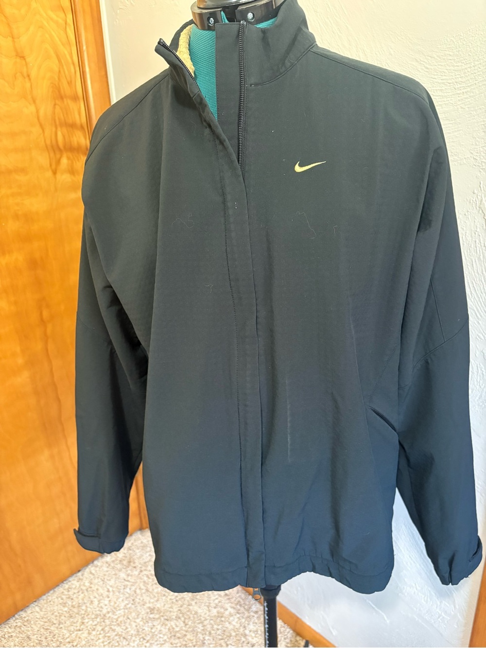 Nike Men's Black Windbreaker with Small Yellow Swoosh